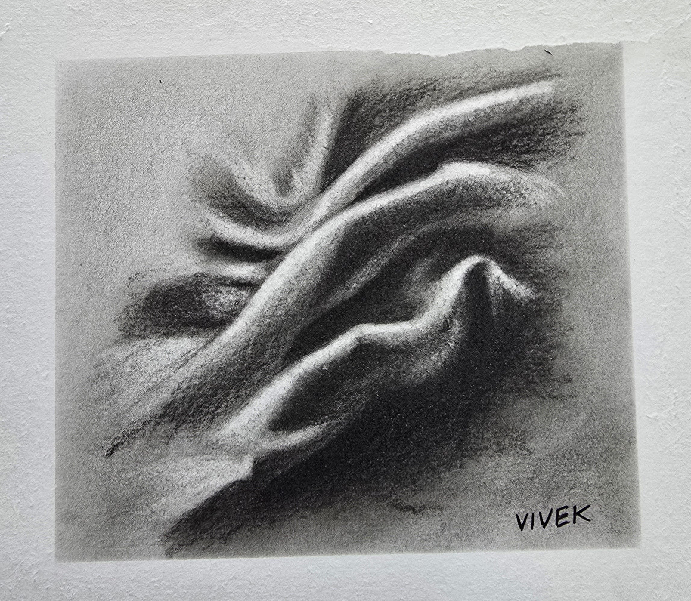Realistic charcoal study of folded fabric